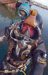 Man wearing a diving suit by the water with a cool flow circulating water cooling vest underneath